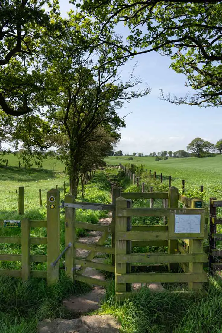 Kissing gate on path between farms