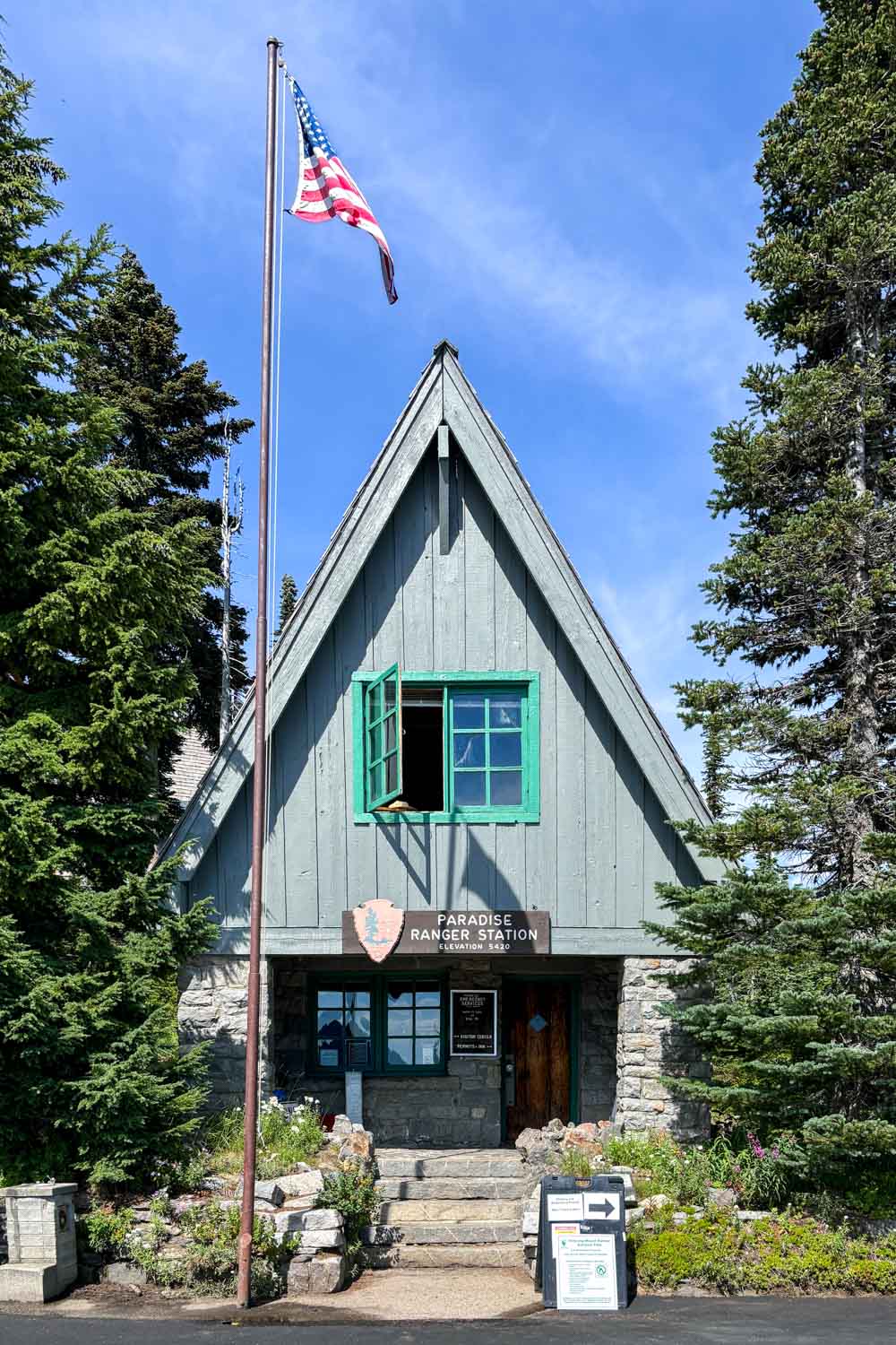 A-frame rangers hut with U.S. flag out front