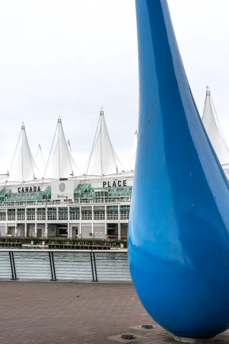 Sculpture resembling a large blue raindrop framing Canada Place