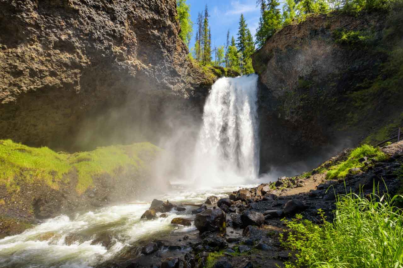 Image of waterfall surrounded by volcanic rock canyon