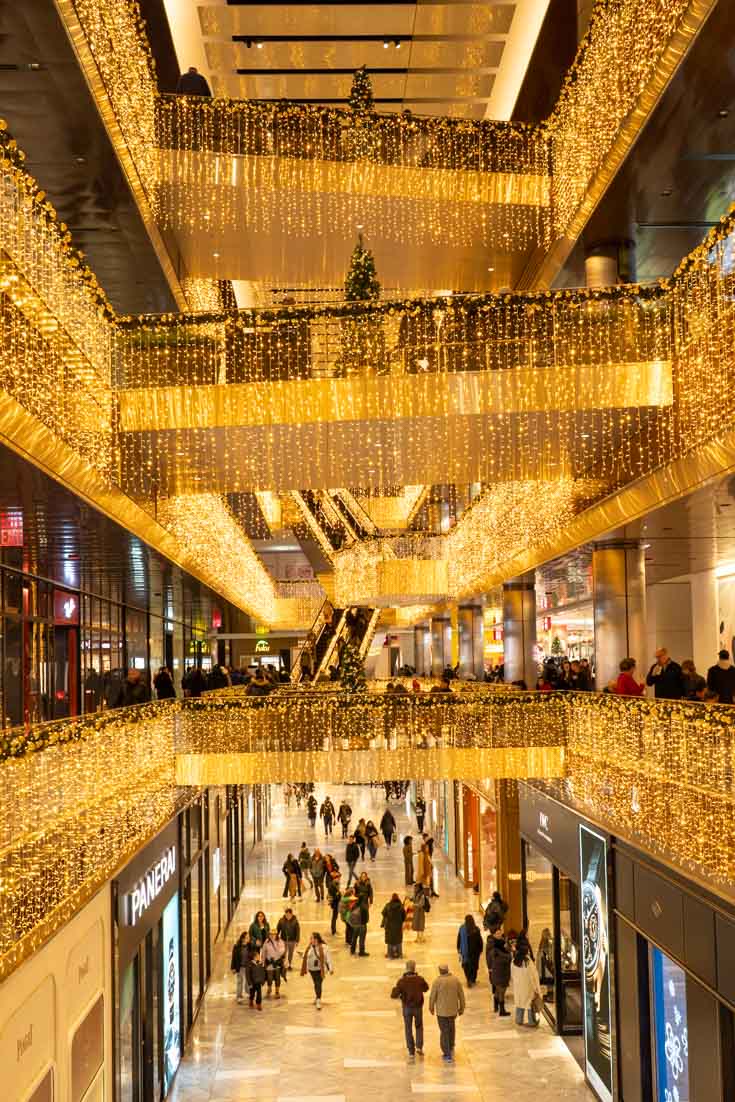 Shopping mall illuminated with golden fairy lights