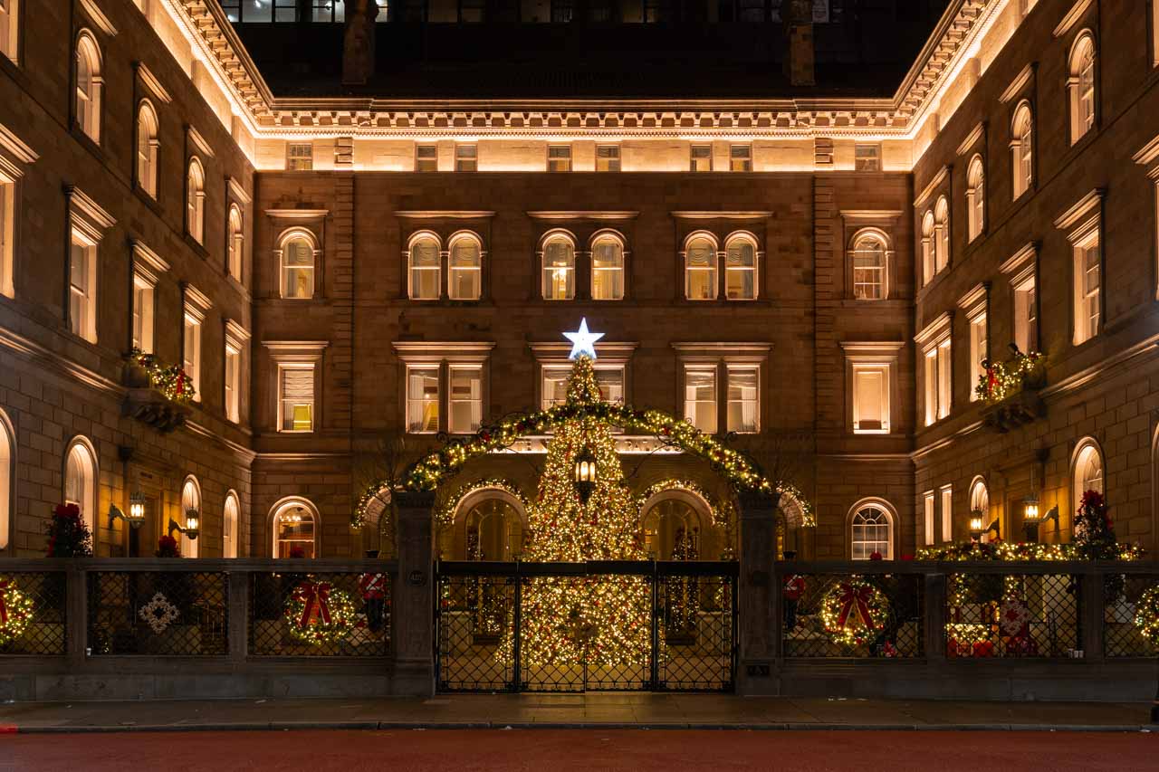 Golden Christmas tree in hotel courtyard, viewed across street