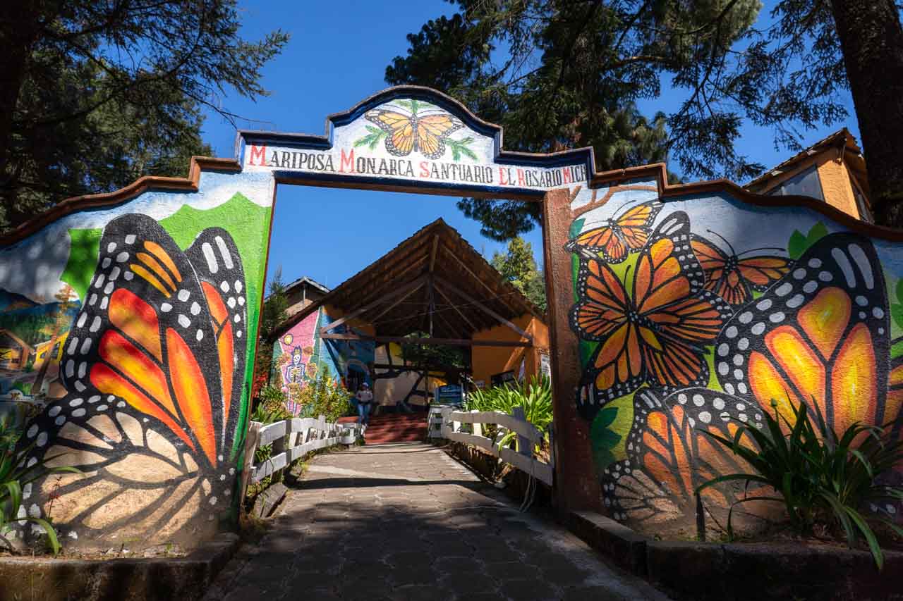 Arched entrance to El Rosario Butterfly Sanctuary with butterfly murals