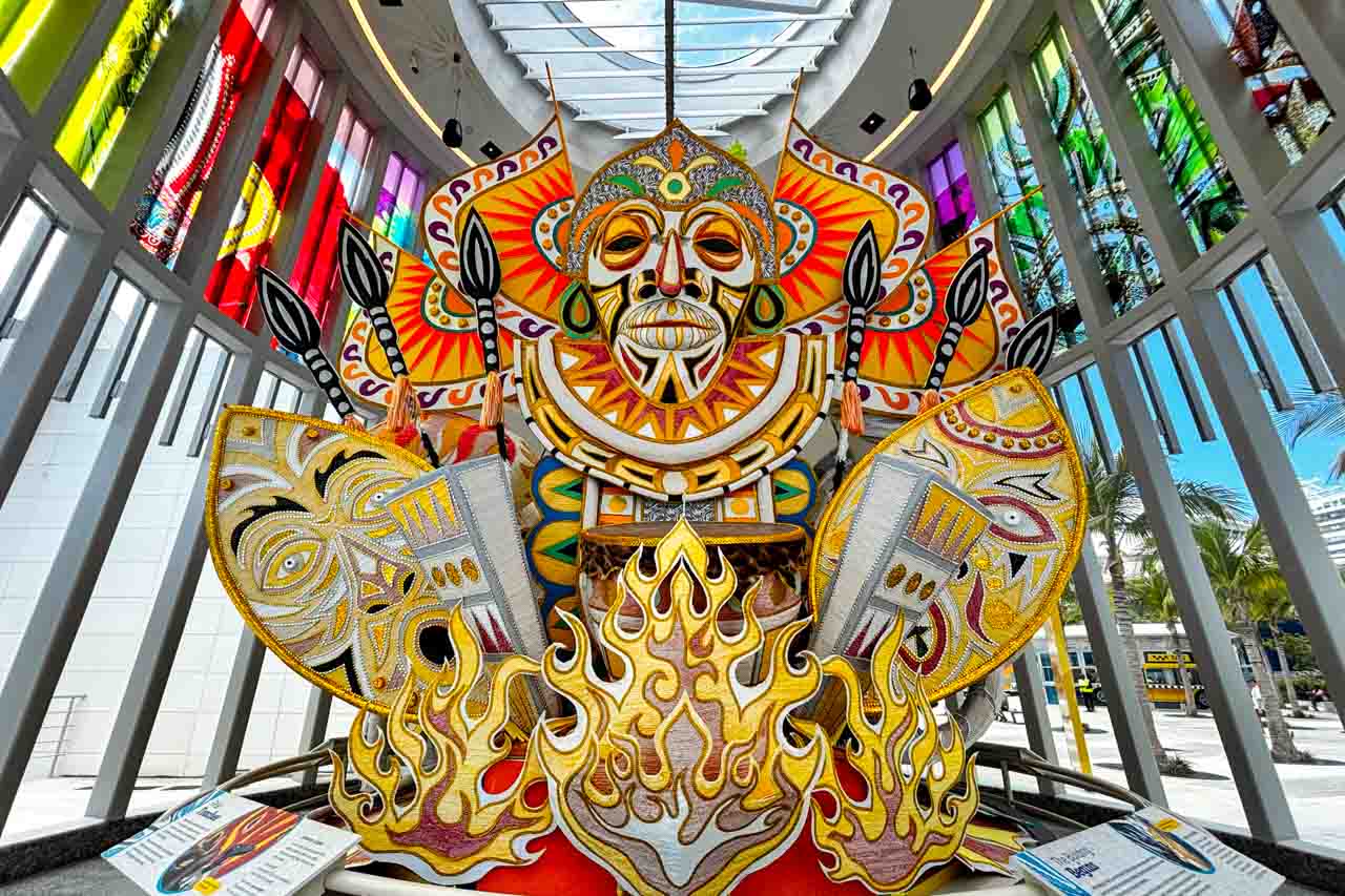 Junkanoo lead costume in custom display in light-filled museum