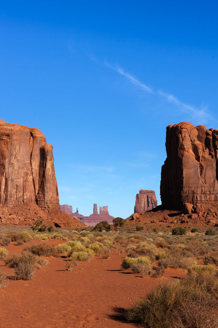 Monument Valley rock formations against blue sky from North Window Overlook
