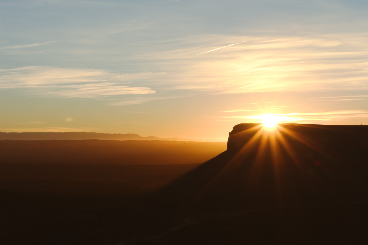 Sunrise sunburst on Mesa in Monument Valley