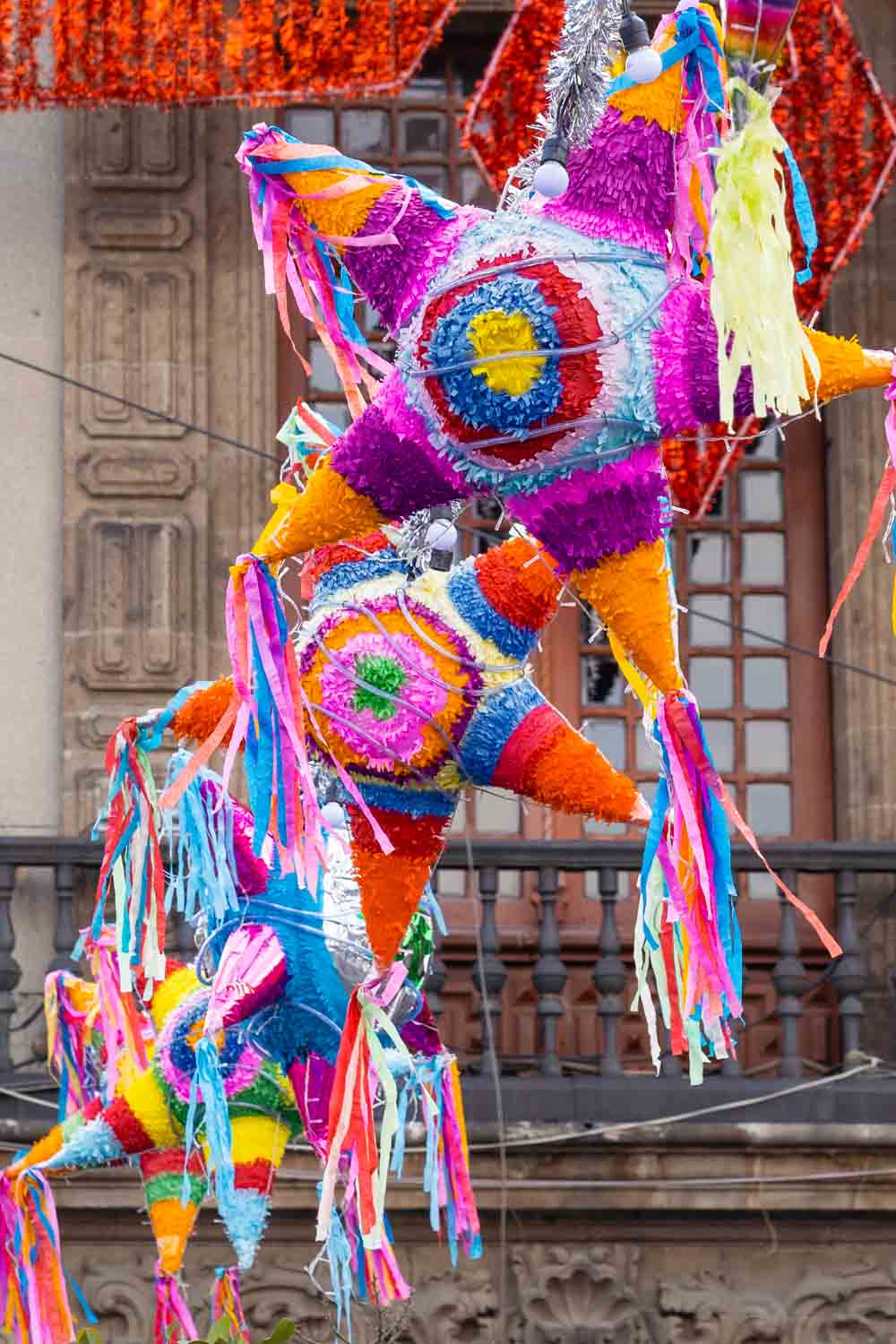 Colourful piñatas hanging over Plaza de la Constitución