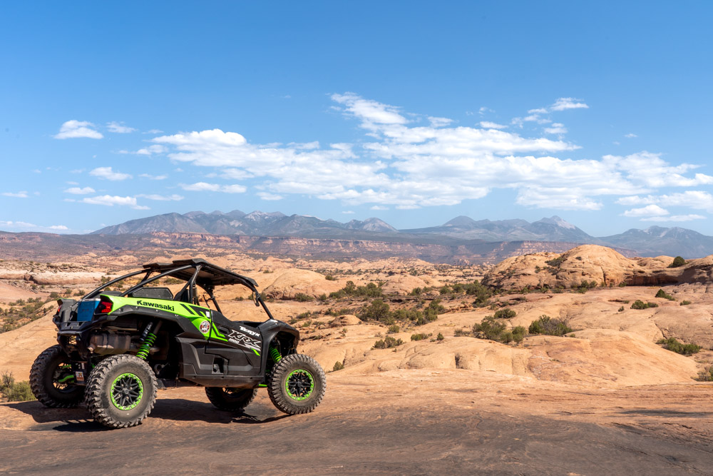 Petrified sand dunes with a UTV parked in the foreground