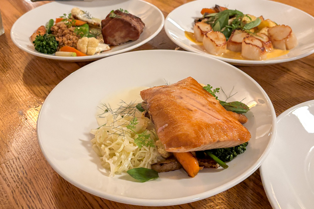 King salmon, pork and scallop dishes at restaurant