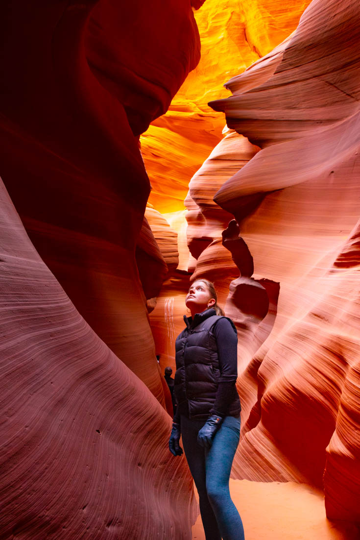 Madam ZoZo looking up at rock formations from the bottom of Antelope Canyon