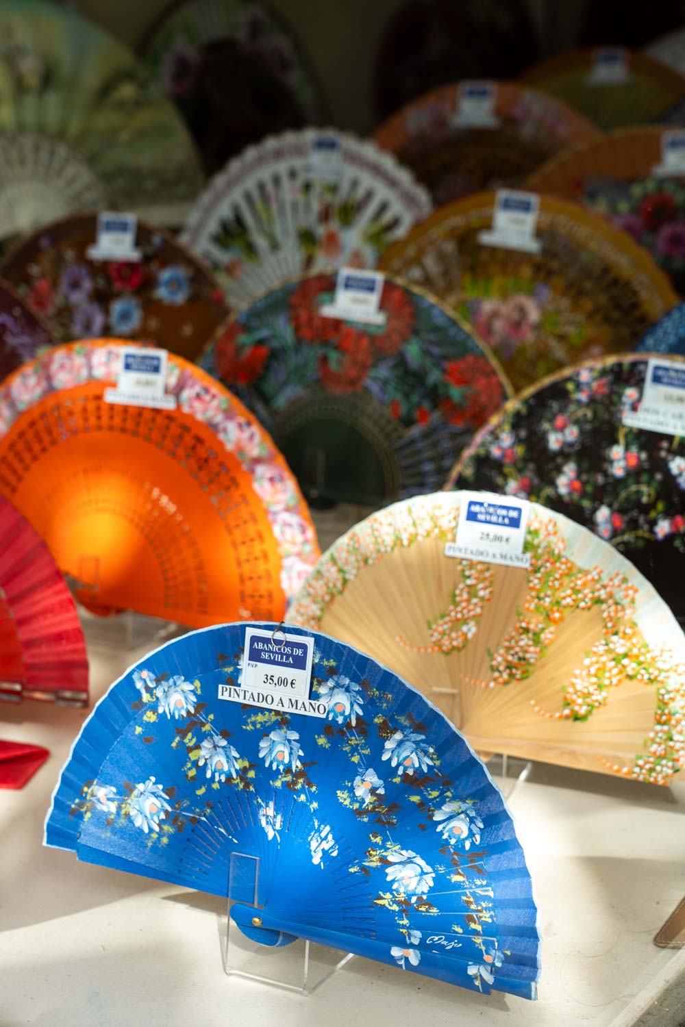 Colourful flamenco fans for sale in a shop window