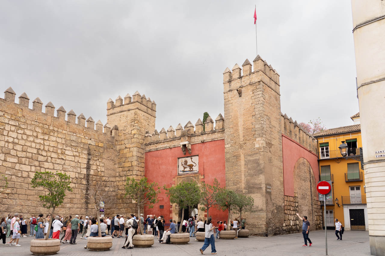 Fortress entrance with red walls and crenulated towers