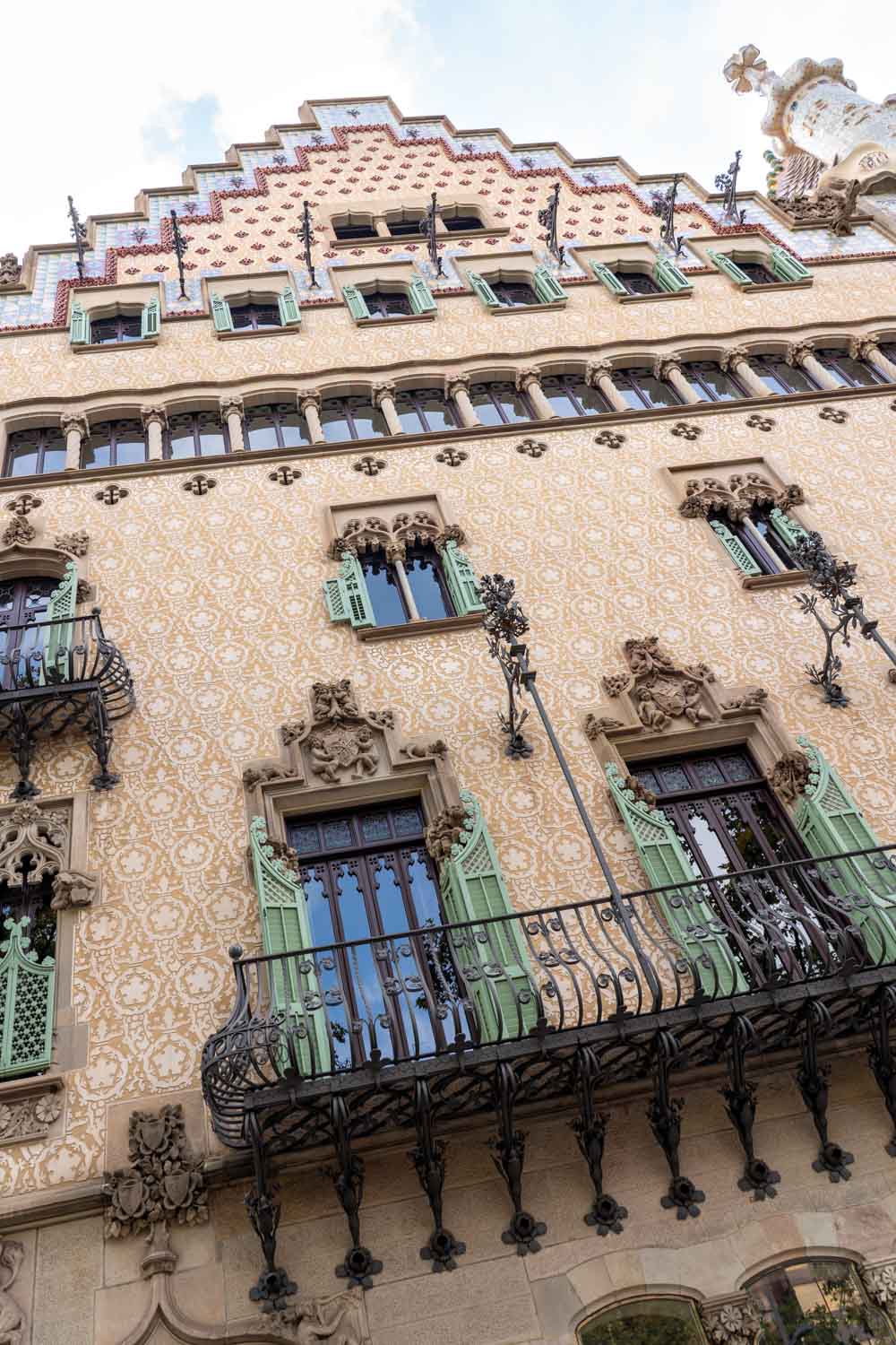 Image looking up at facade of Casa Amatller with Gothic-inspired detailing