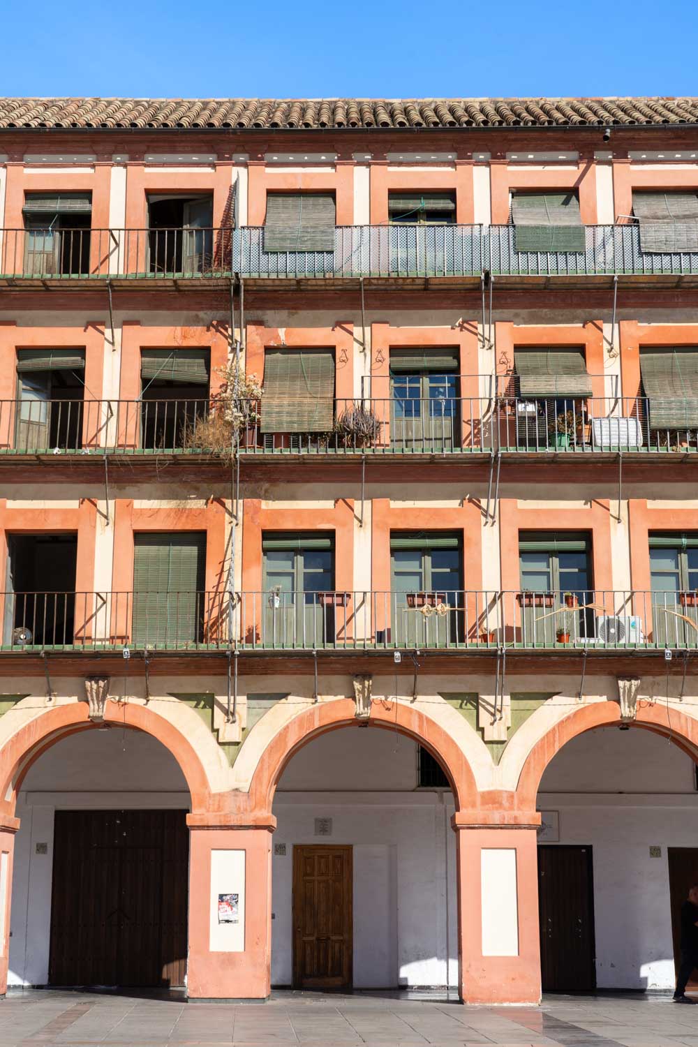 Architecture surrounding Plaza de la Corredera with arched colonade at ground-level