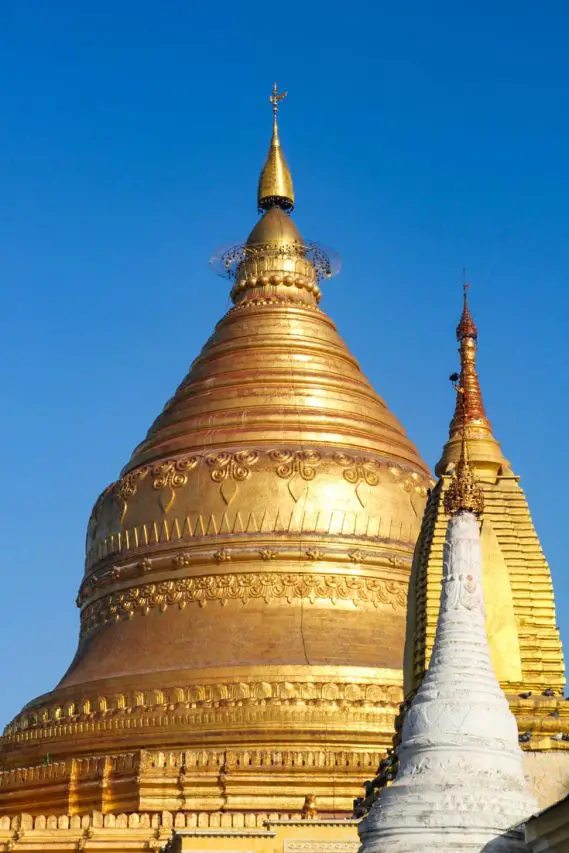 Gold stupa against blue sky