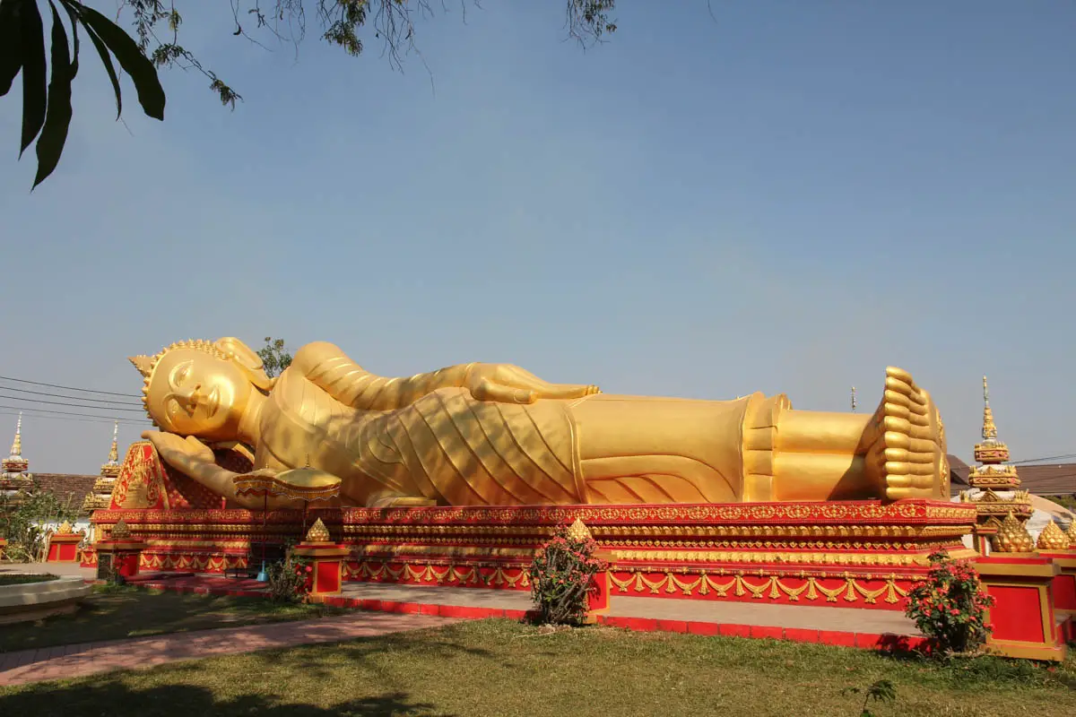 Large, gold and red reclining Buddha monument