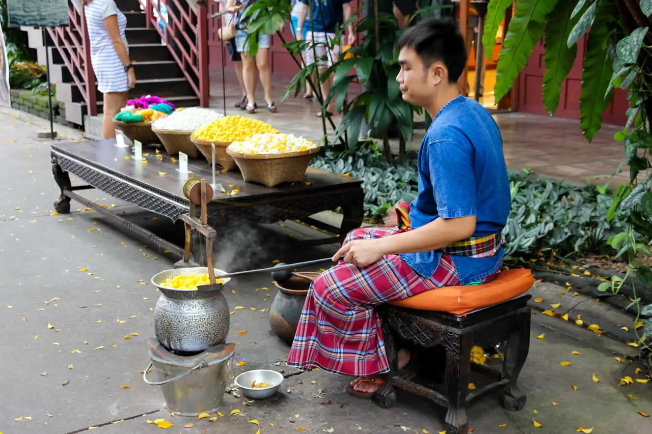 A demonstration of silk worm cocoons being boiled - a step in the silk-making process