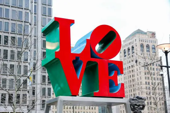 Photo of LOVE sculpture with skyscrapers in background