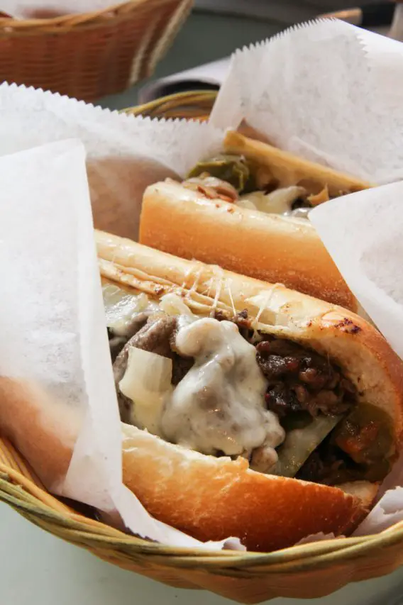 Photo of fresh cheesesteak in a basket lined in paper