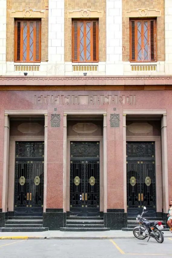 Three doors with window above each, on art deco building facade