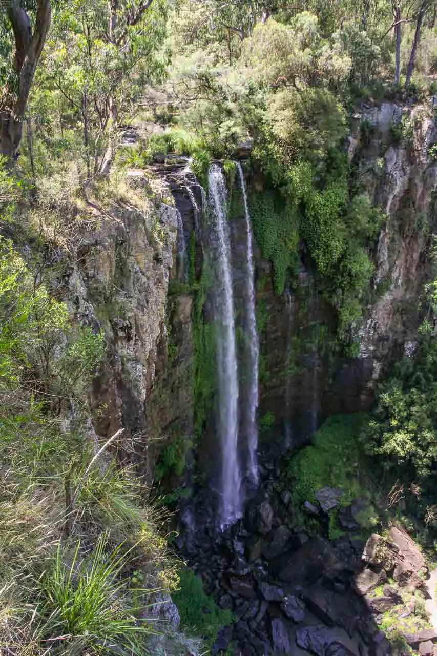 Tall, single drop waterfall over rocky cliff