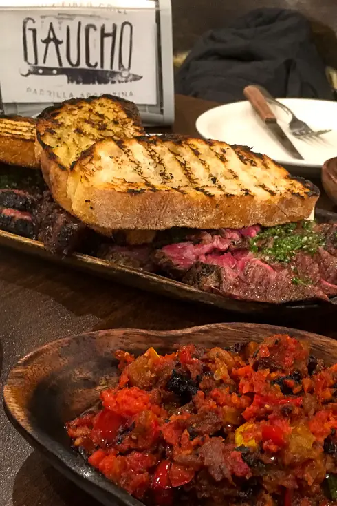 Plates of steak, toast and sides