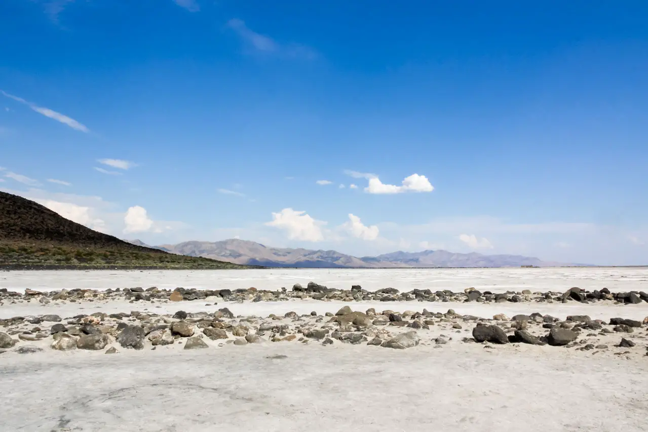 Photo of the surrounding landscape, from standing on Spiral Jetty looking out across salt crust and distant mountains