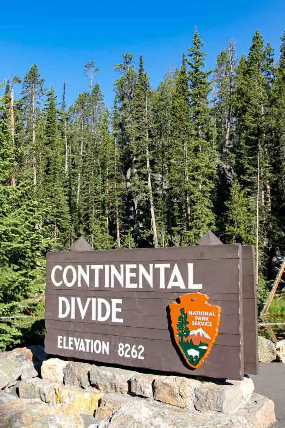 Continental Divide marker wit forest in the background