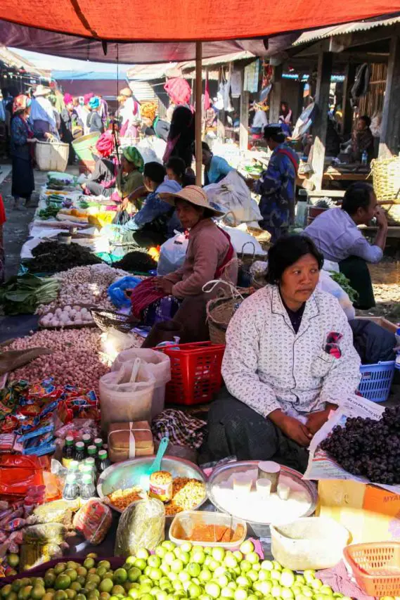 Women selling fresh produce in an outdoor market