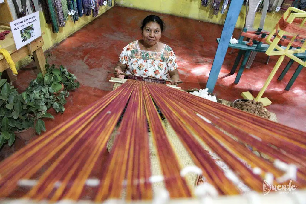 Woman weaving on backstrap loom in San Juan de Atitlan, Guatemala