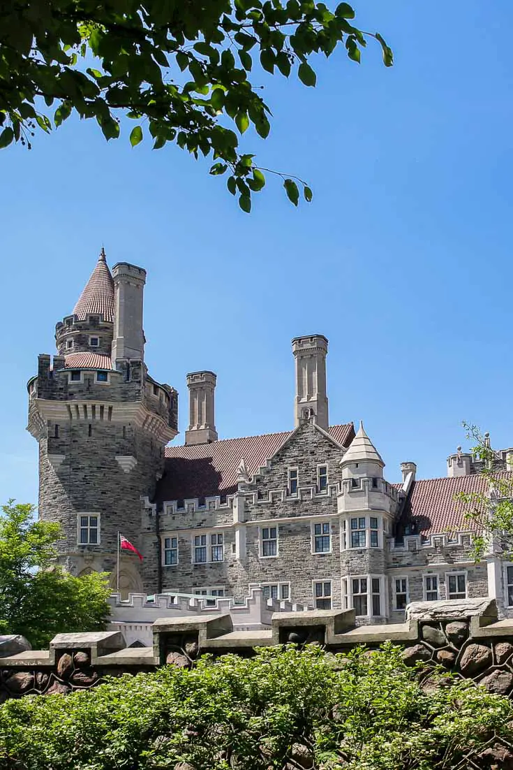 Casa Loma viewed over the crenulated fence from park