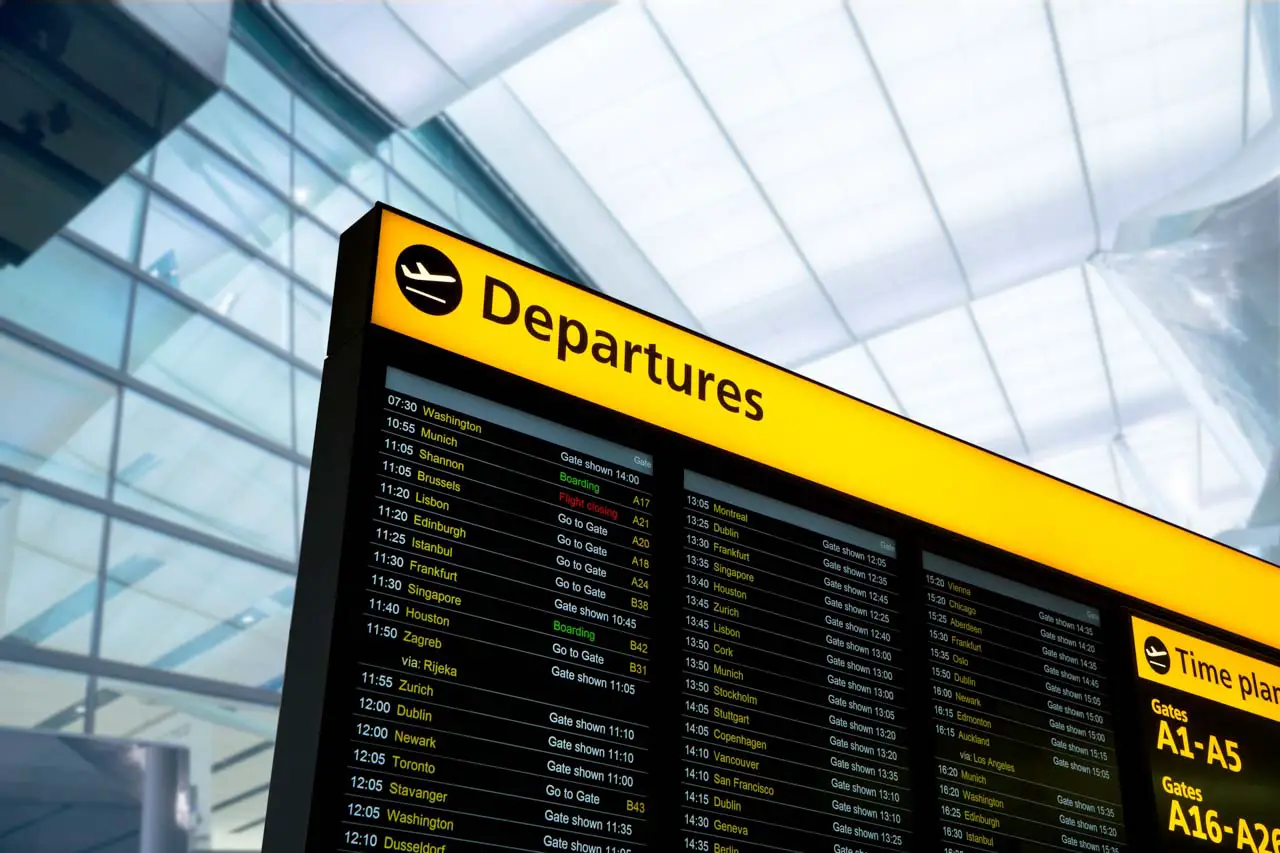 Airport flight information board showing departures