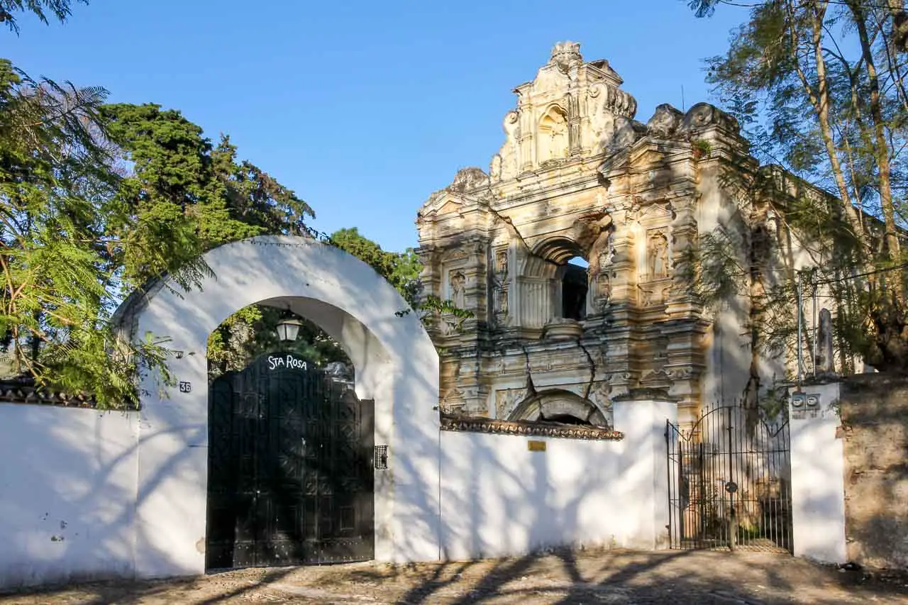Santa Rosa ruins behind a white fence with black gate
