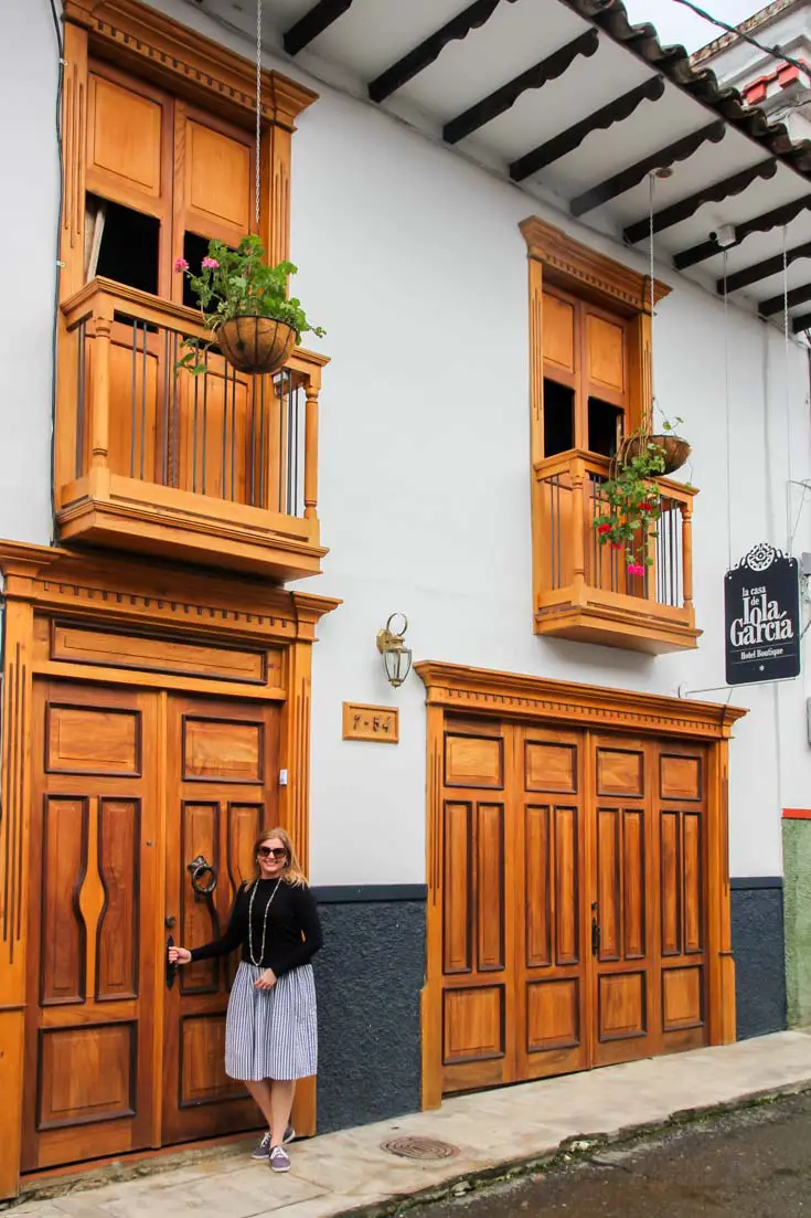 Detailed wooden doors and balconies with hanging flower pots