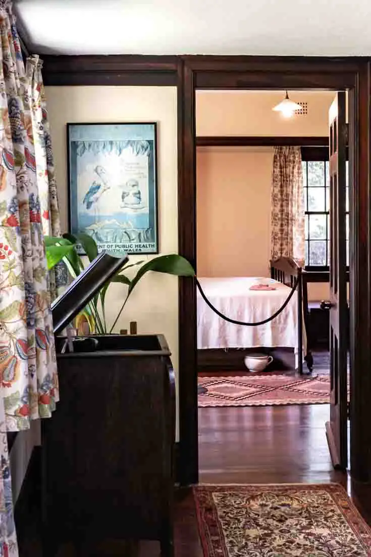 Photo of Arts and Crafts interior with view throug doorway to bedroom.