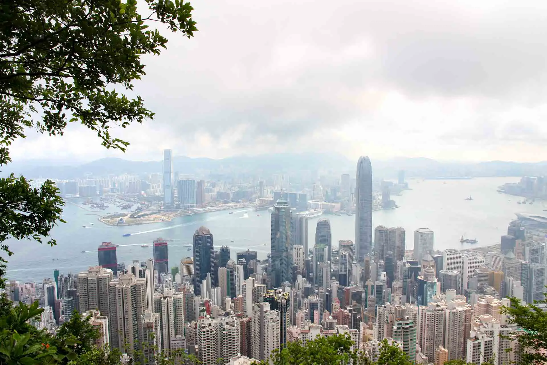 View from Victoria Peak looking down on skyscrapers of Hong Kong Island, with Kowloon in background