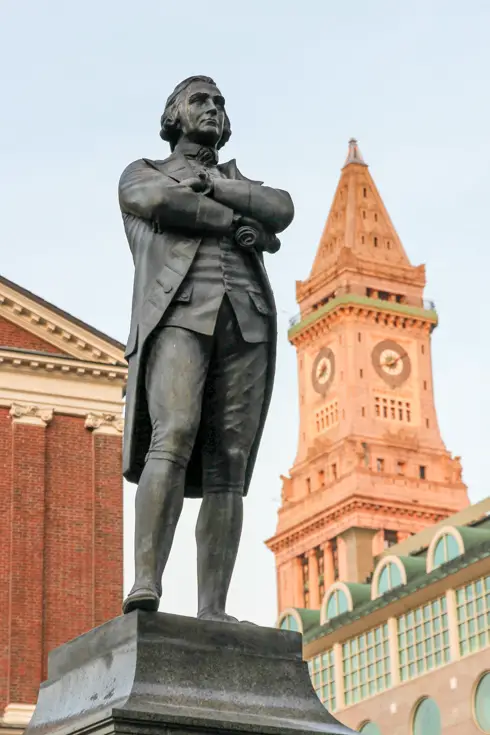 Samuel Adams Statue infront of Custom House Tower at sunset