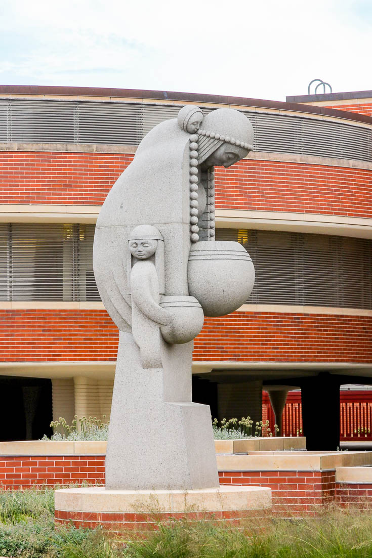 Sculpture of Native American woman with children, designed by Frank Lloyd Wright
