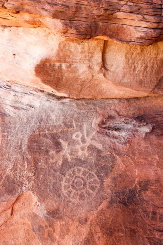 Photo of ancient petroglyphs on red rock