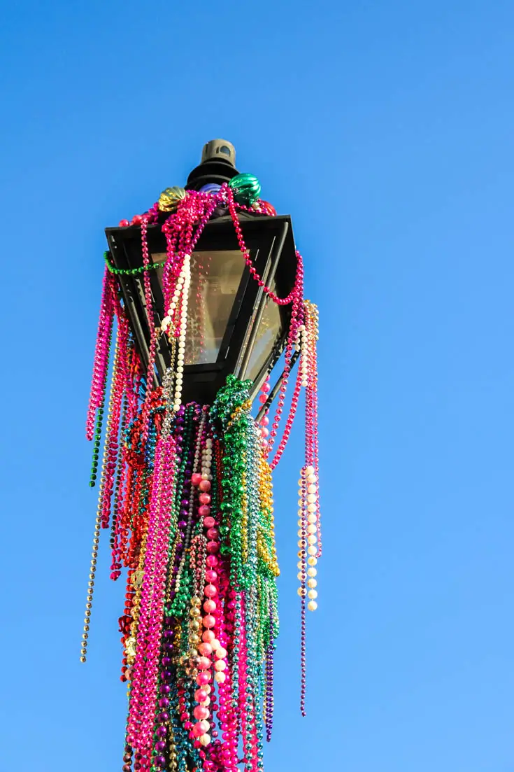 Carnival throws on a lamp post in the French Quarter