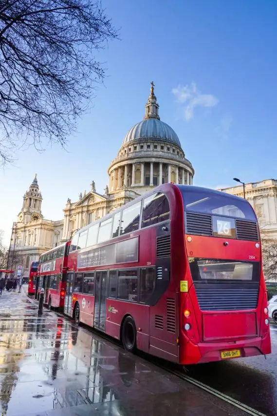 Red, double-decker buses parked outside St Paul's Cathedral