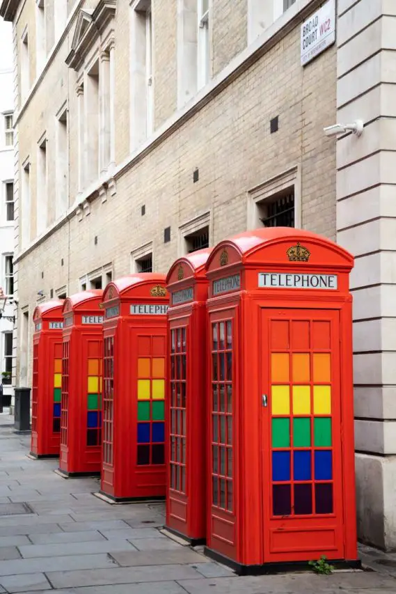 Red phone boxes with Pride flag colours