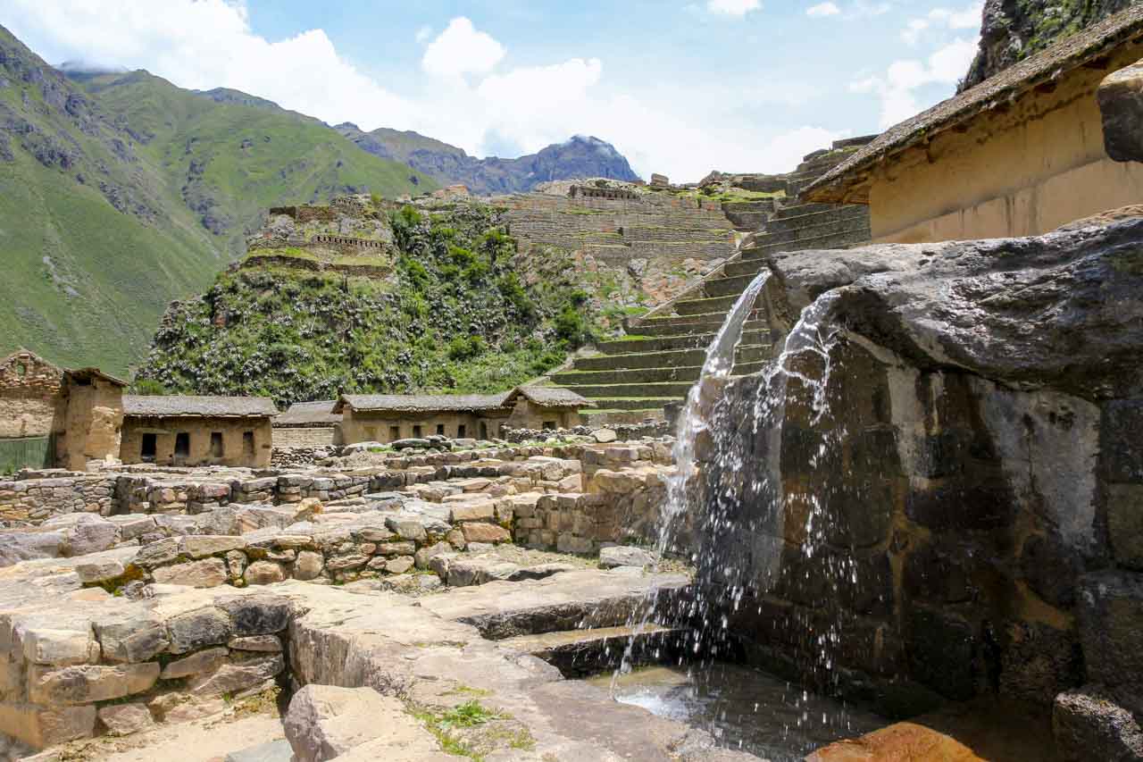 Ruins of Ollantaytambo with Inca tap in foreground