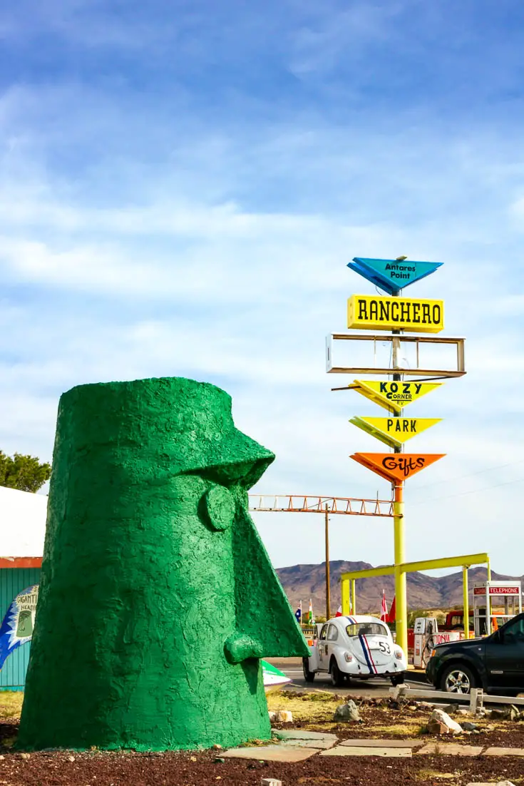 Large geometric green head mid-century outside gas station