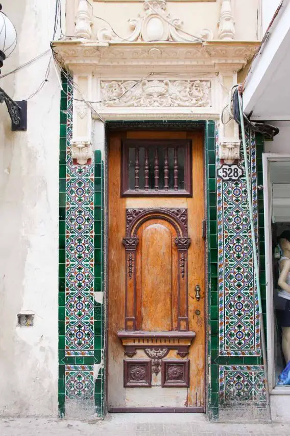 Wooden door framed in decorative tiles, Havana