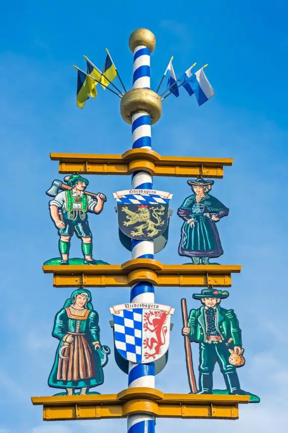 Maypole at Oktoberfest in Munich in Bavaria against blue sky