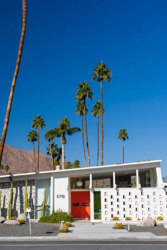 Mid-century modern home with vibrant orange doors