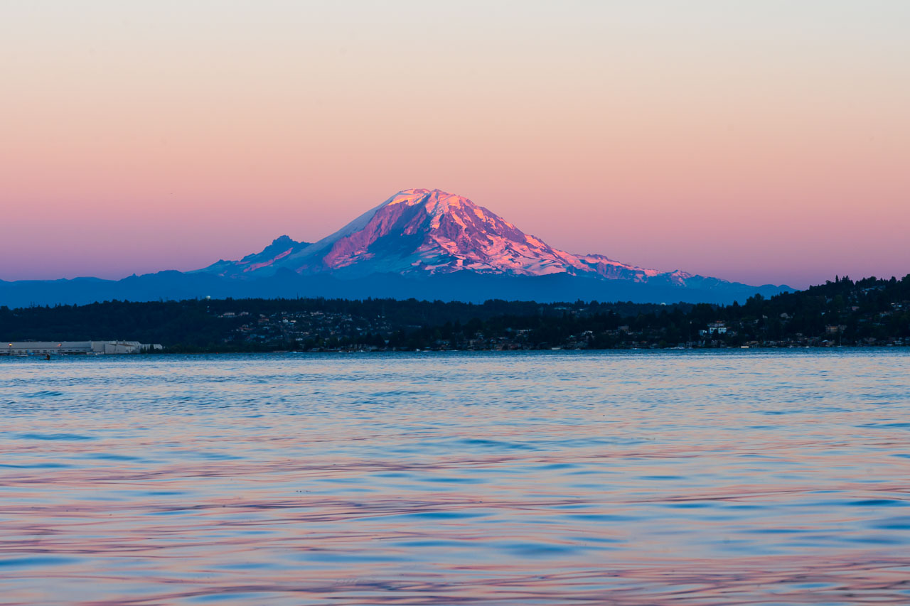 Mount Rainier glowing pink at sunset, viewed from Seward Park