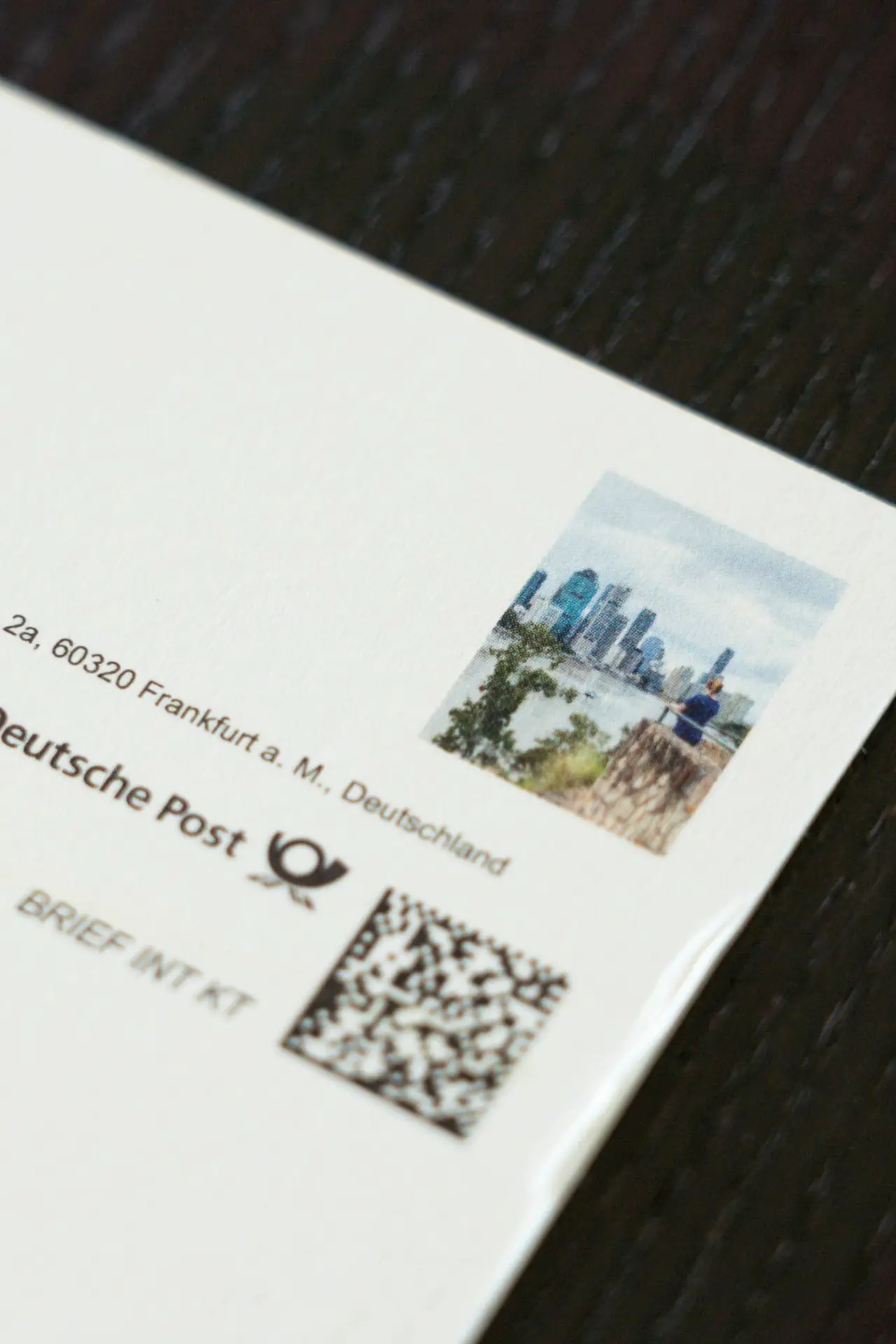 Close-up photo of personalised "stamp" on the Postando postcard