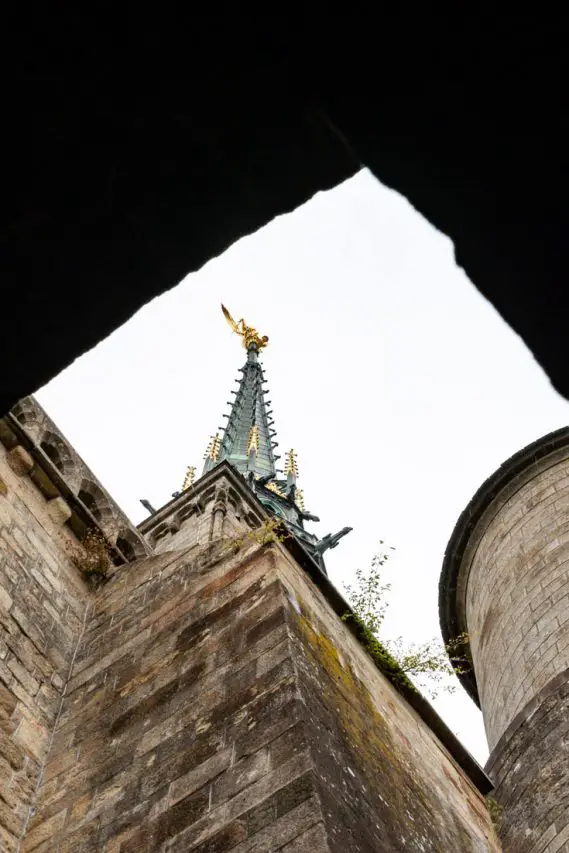 Gilded St Michel statue on church spire
